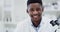 Science, research and face of black man with microscope, smile and medical engineering in laboratory. Biotechnology