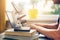 Science student learning at home with books and laptop