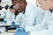 Science students, research and writing in laboratory, experiment and healthcare innovation. Researchers, notebooks and