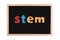 Science Technology Engineering Mathematics. STEM word on school blackboard for background.