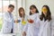 Science Test. Chemist scientific testing quality. Group Scientist working at laboratory. One Man and Three woman at chemistry lab