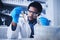 Science, test tube and black man in laboratory with liquid for research, medical exam and sample analysis. Healthcare