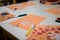 scientific activity for children, drawing and collage of the bones of the hand. On a decorated orange sheet a hand was drawn and