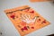 scientific activity for children, drawing and collage of the bones of the hand. On a decorated orange sheet a hand was drawn and