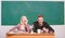 Scientific experiment. Guy and girl at desk with microscope. Studying in college or university. Biology lesson. Students