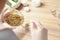 Scientist developing cosmetic product at wooden table in laboratory, closeup