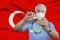 Scientist, doctor does test, develops a vaccine, medicine against the background of the silk flag of Turkey, the concept of