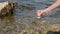 Scientist or environmental expert with a test tube taking a probe to control the quality of polluted water in a toxic