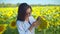 Scientist examining seeds under magnifier in field