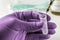 Scientist with green latex gloves manipulates vial and syringe in laboratory