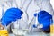 Scientist hands holding some liquid in a glassware in laboratory for analysis