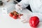 Scientist holding syringe and making experiment with vegetables in lab