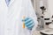 Scientist holding test tube with corn inside