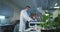 Scientist loading vials into a testing machine