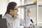 Scientist looking at test tube flask working in laboratory closeup portrait