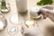 Scientist making cosmetic product at wooden table, closeup