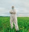 Scientist man standing on summer field