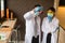 Scientist man and woman holding and looking at glass test tube. Chemist examines chemical test tube, science, doctor