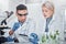 Scientist, man and woman with tablet, laboratory and ecofriendly science. Agriculture, research and scientists with