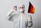 Scientist medic with Germany flag and vaccine flask