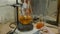 Scientist mixing liquids in flasks in a research lab. Special equipment for mixing fluids in lab. Intern mixing