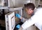 Scientist prepares chromatograph oven