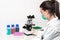 Scientist researcher using microscope in laboratory. Medical healthcare technology and pharmaceutical research and