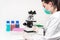 Scientist researcher using microscope in laboratory. Medical healthcare technology and pharmaceutical research and