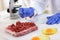 Scientist taking sample of meat to making test quality, food qua