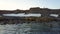 Scientist and tourists on feeding base of walruses on New Earth Vaigach Island.