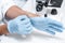 Scientist wearing protective gloves in chemical laboratory