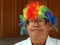 Scientist wears a clown wig