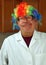 Scientist wears a clown wig