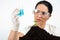 Scientist woman analyze blue liquid