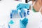 Scientists are carrying blue chemical test tubes to prepare for the determination of chemical composition and biological mass in a