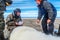 Scientists from a scientific expedition make measurements and marking of a sleeping polar bear.