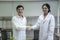 Scientists shake hands to do scientific experiments