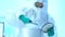 Scientists waring protective clothing and were taking chemicals out of storage security. Scientists are producing vaccines to trea