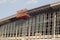 Scissor elevated lift platform. Multi-storey with many glass Windows .background of glass windows of modern office building .