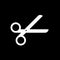 Scissor vector icon isolated on black background.
