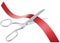 Scissors cutting red ribbon, isolated.