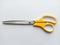 Scissors stainless steel yellow and white handle.