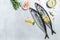 Scomber, marinated mackerel or herring fish with salt, lemon and spices on a light background. Seafood concept. top view