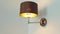 Sconce fixed to white wall, light fixture as home decor and interior design detail