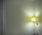 Sconce Shining Light On Wall In Room