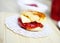Scones with strawberry jam on wooden plate for dessert food concept