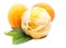 A scoop of apricot ice cream with mint and real apricots