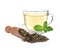 Scoop with dry green tea leaves and cup of aromatic beverage on white background