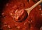 Scoop up the tomato sauce in the pan with a spoon