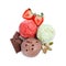 Scoops of different ice creams with strawberry, chocolate and pistachio nuts on white background, top view